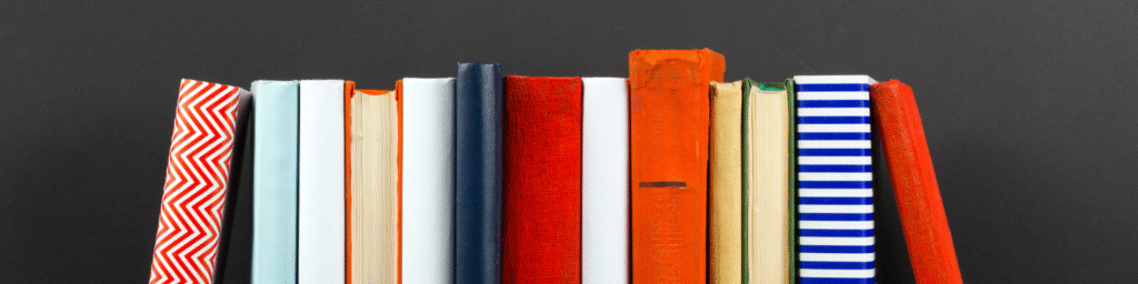 Books stacked neatly on desk background